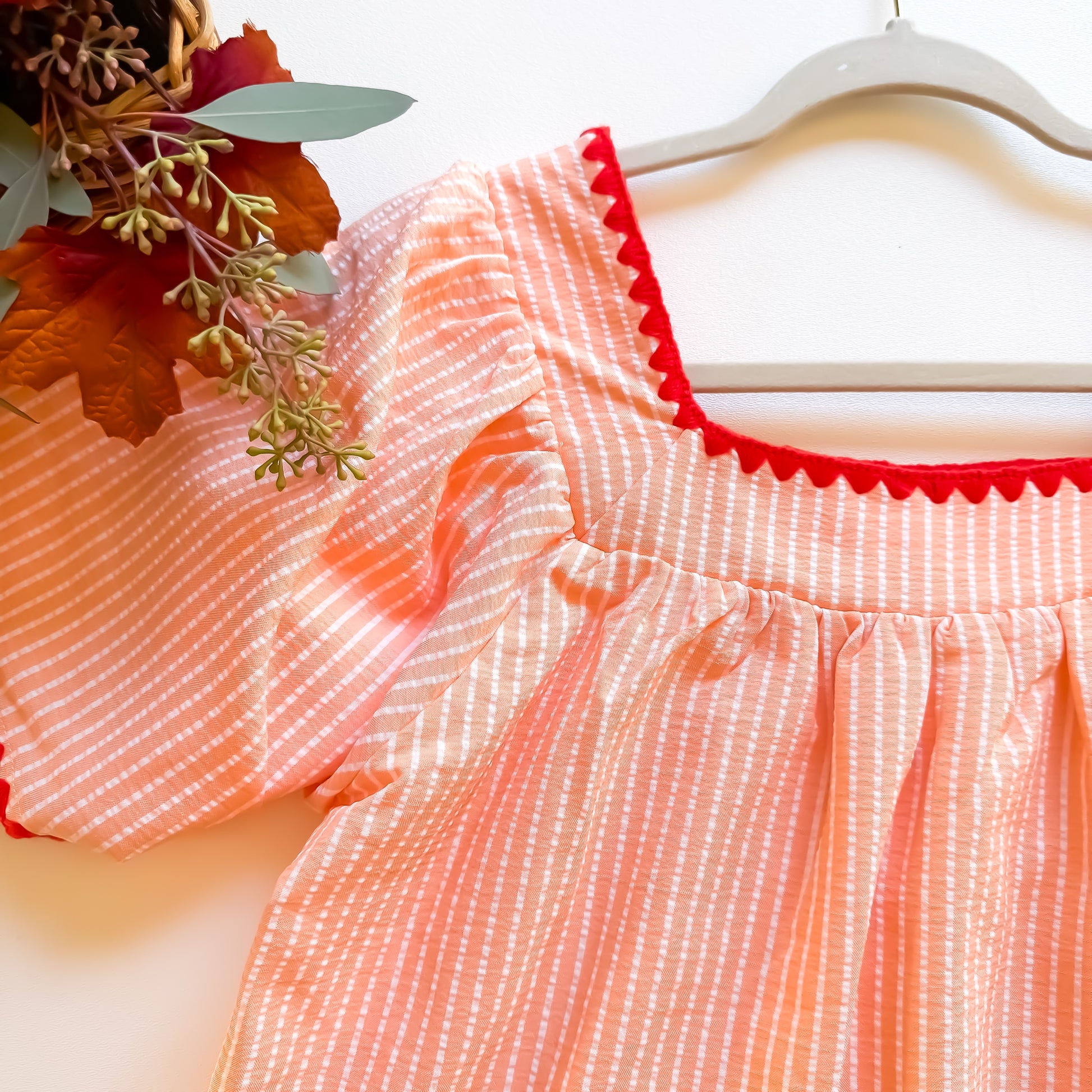 Apricot dress neckline and sleeve detail