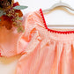 Apricot dress neckline and sleeve detail