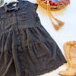 Angled view of tiered skirt on washed black Umgee plus shirt dress