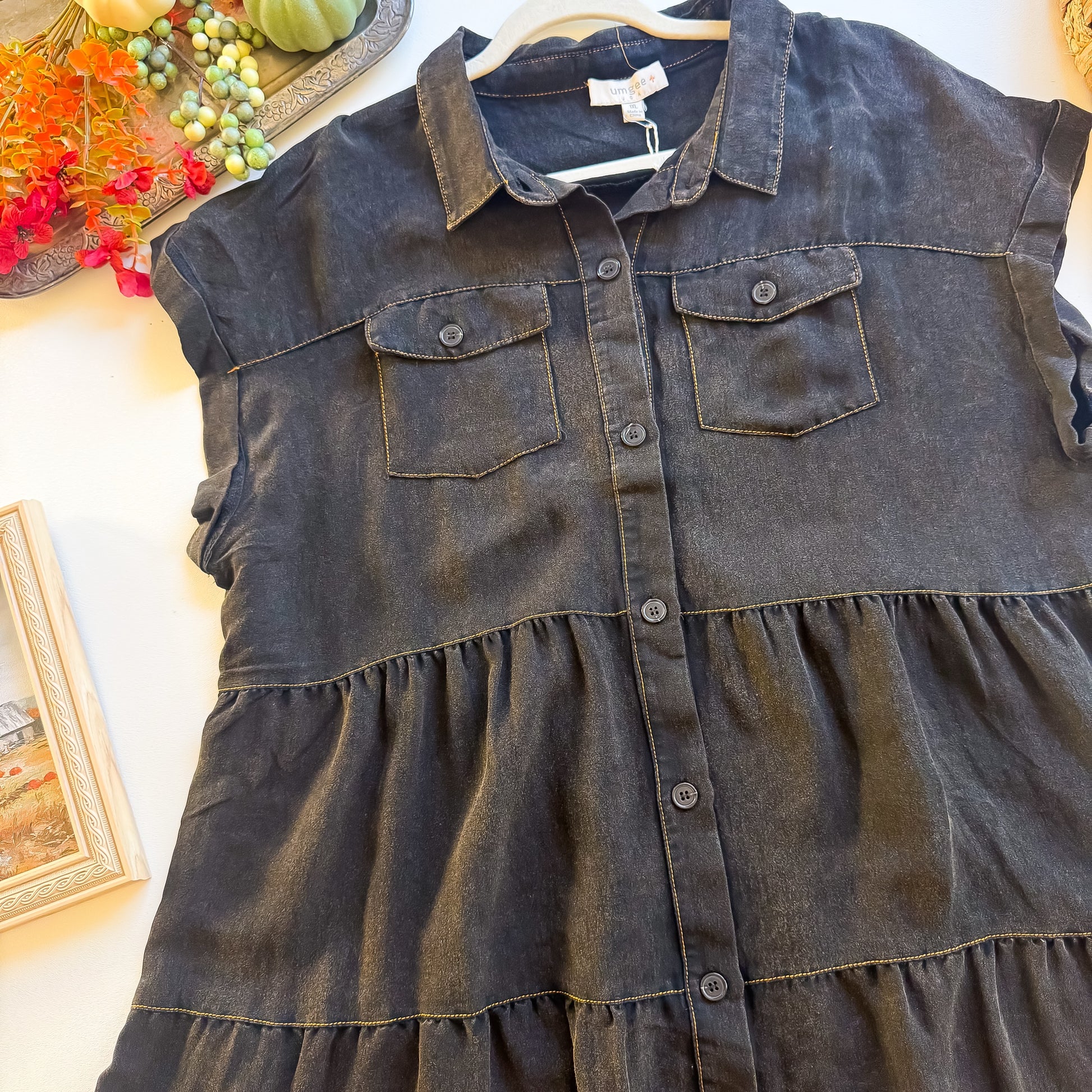 Close-up of collar, double chest pockets and button front on washed black Umgee plus dress