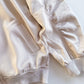 Cream bomber jacket pocket and ruched sleeve detail