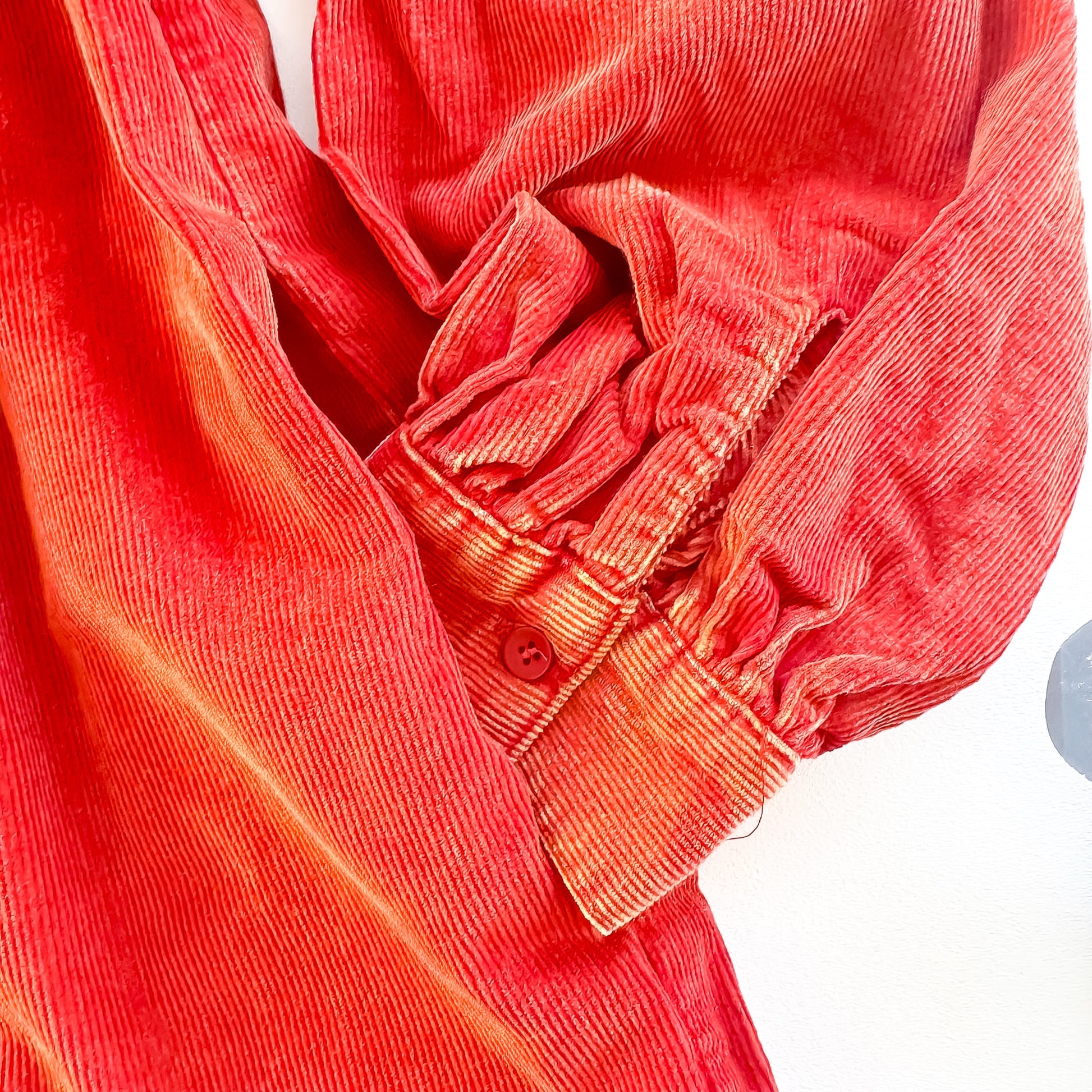 Rust corduroy dress sleeve cuff detail