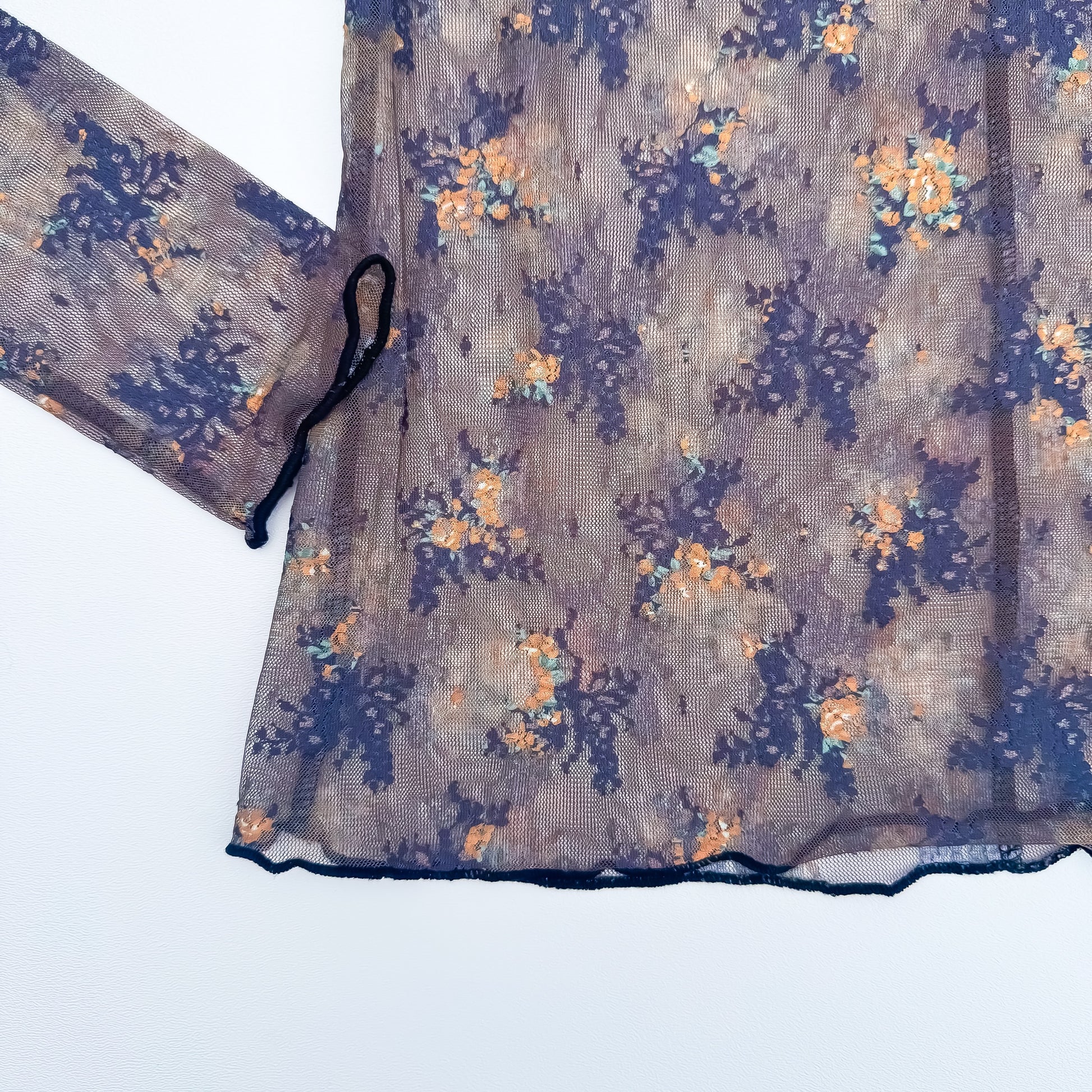 Floral mesh top lettuce edge hem detail