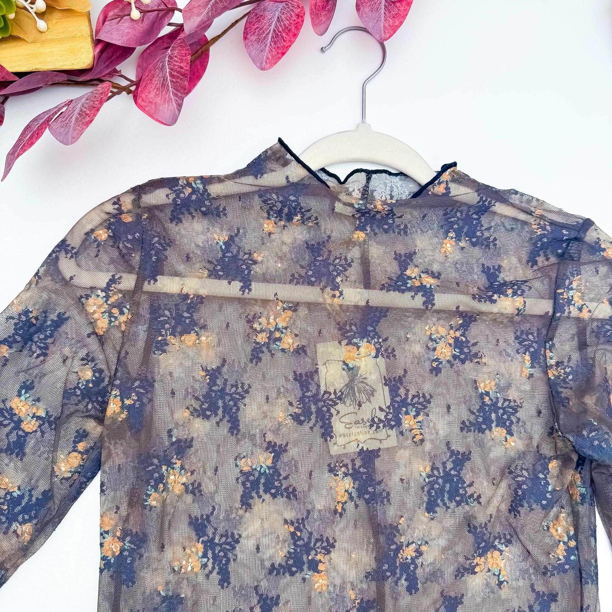 Floral mesh top mock neck detail