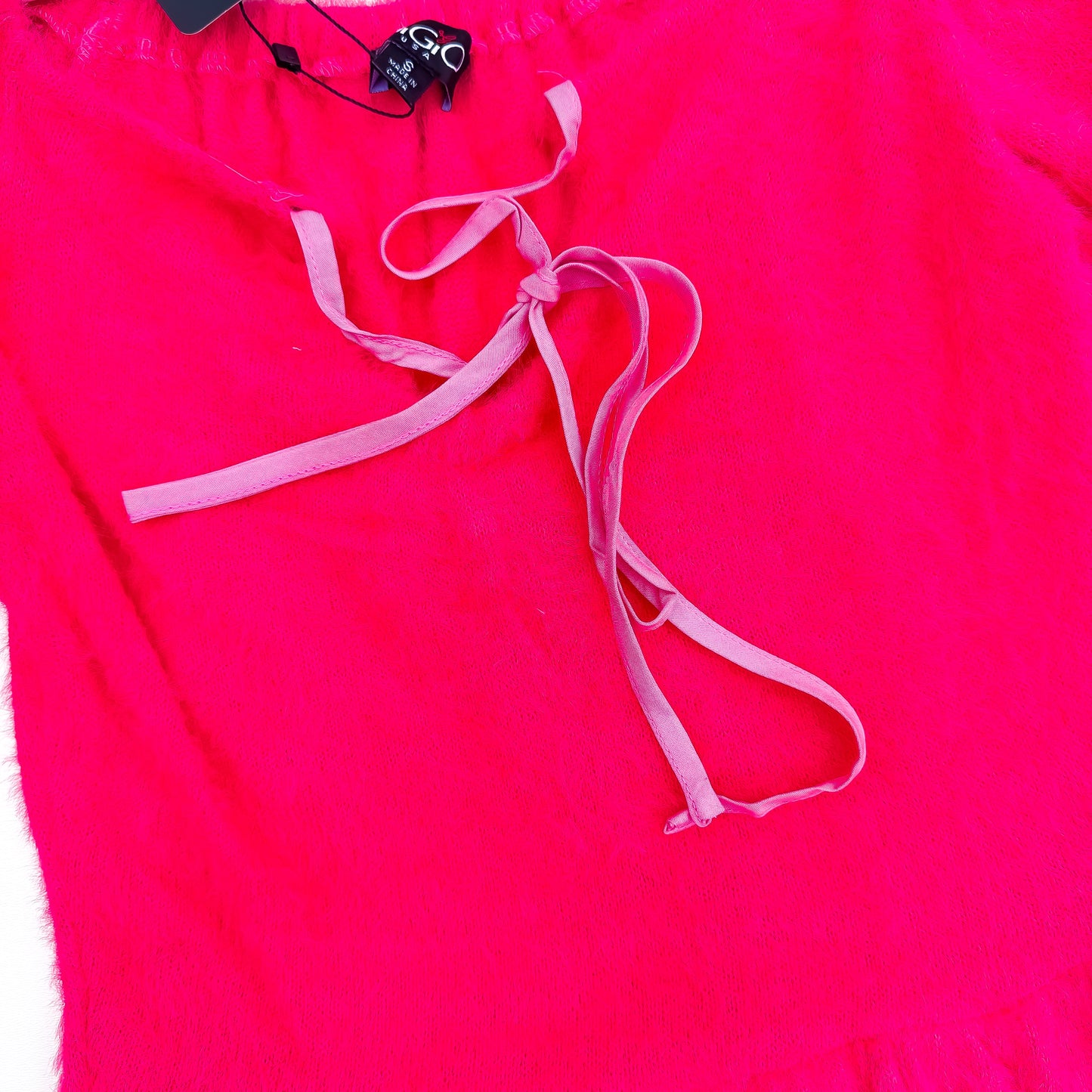 Hot pink fuzzy sweater ribbon tie detail