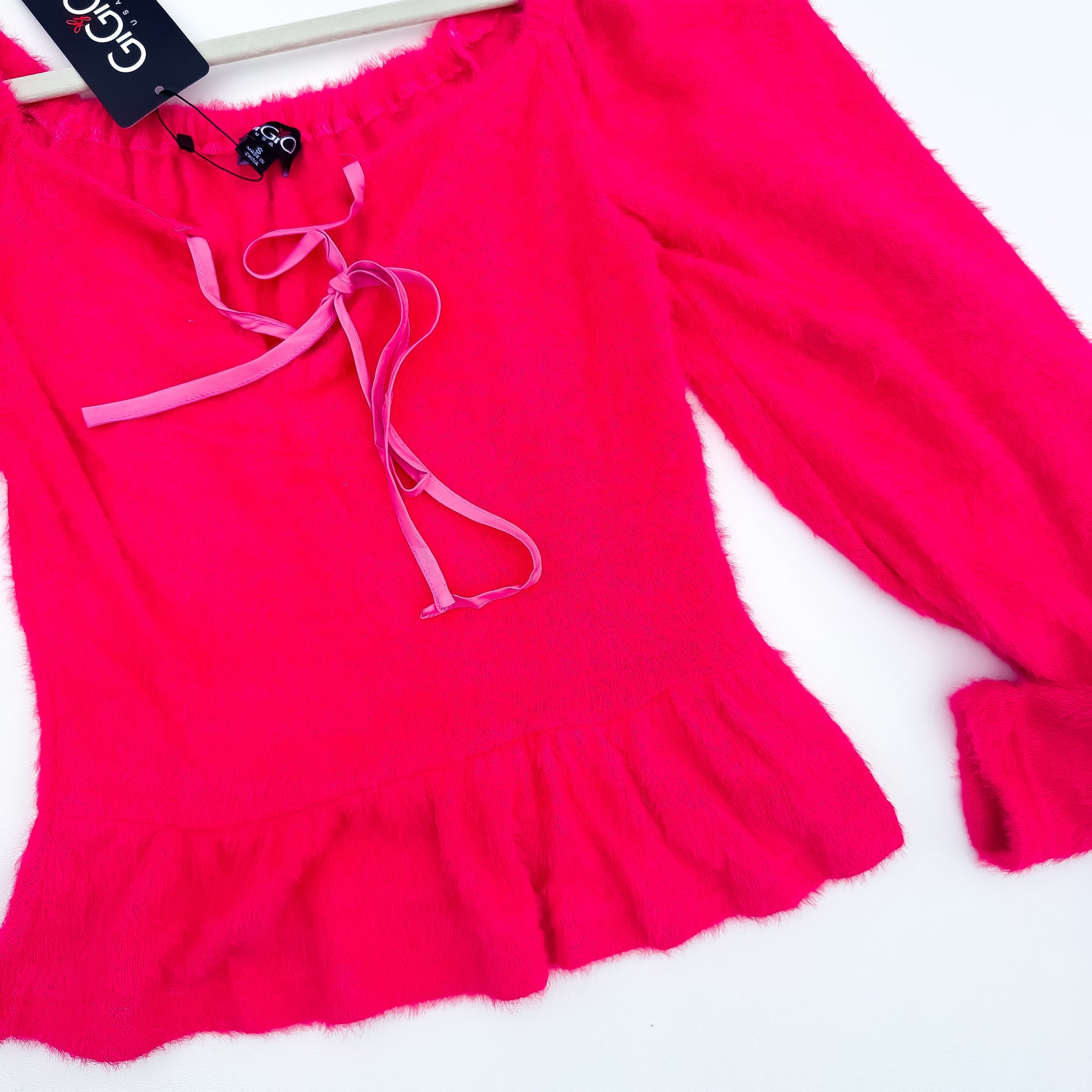 Hot pink fuzzy sweater peplum hem
