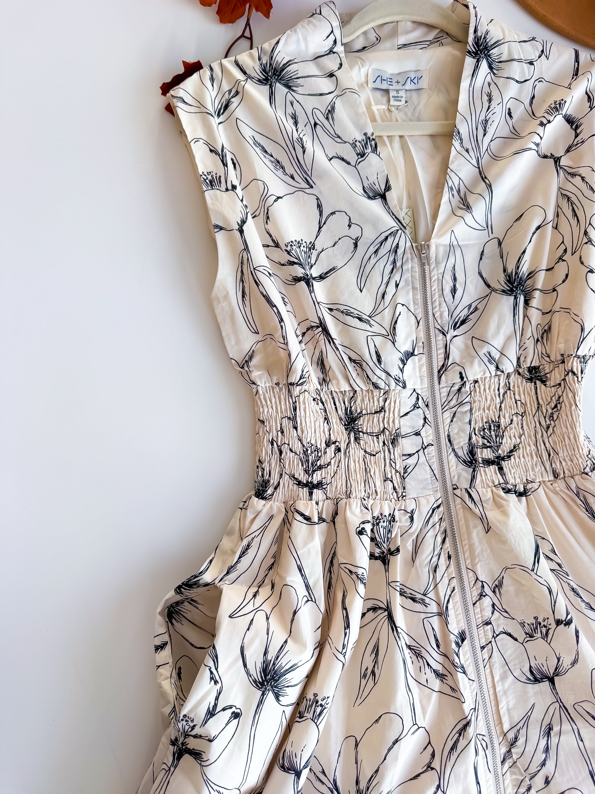 Cream and black floral zip front smocked waist midi dress