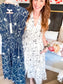 Floral zip front midi dress on model with pocket