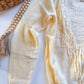 Cream fringe sweater knit and fringe detail