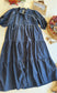 Navy tiered Umgee dress with puff sleeves and seersucker texture, flat lay