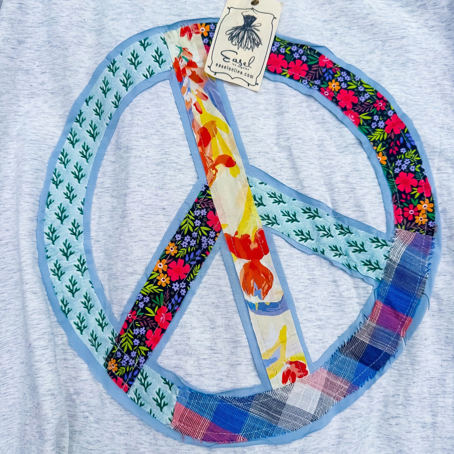 Patchwork peace sign detail on Heather Gray tee