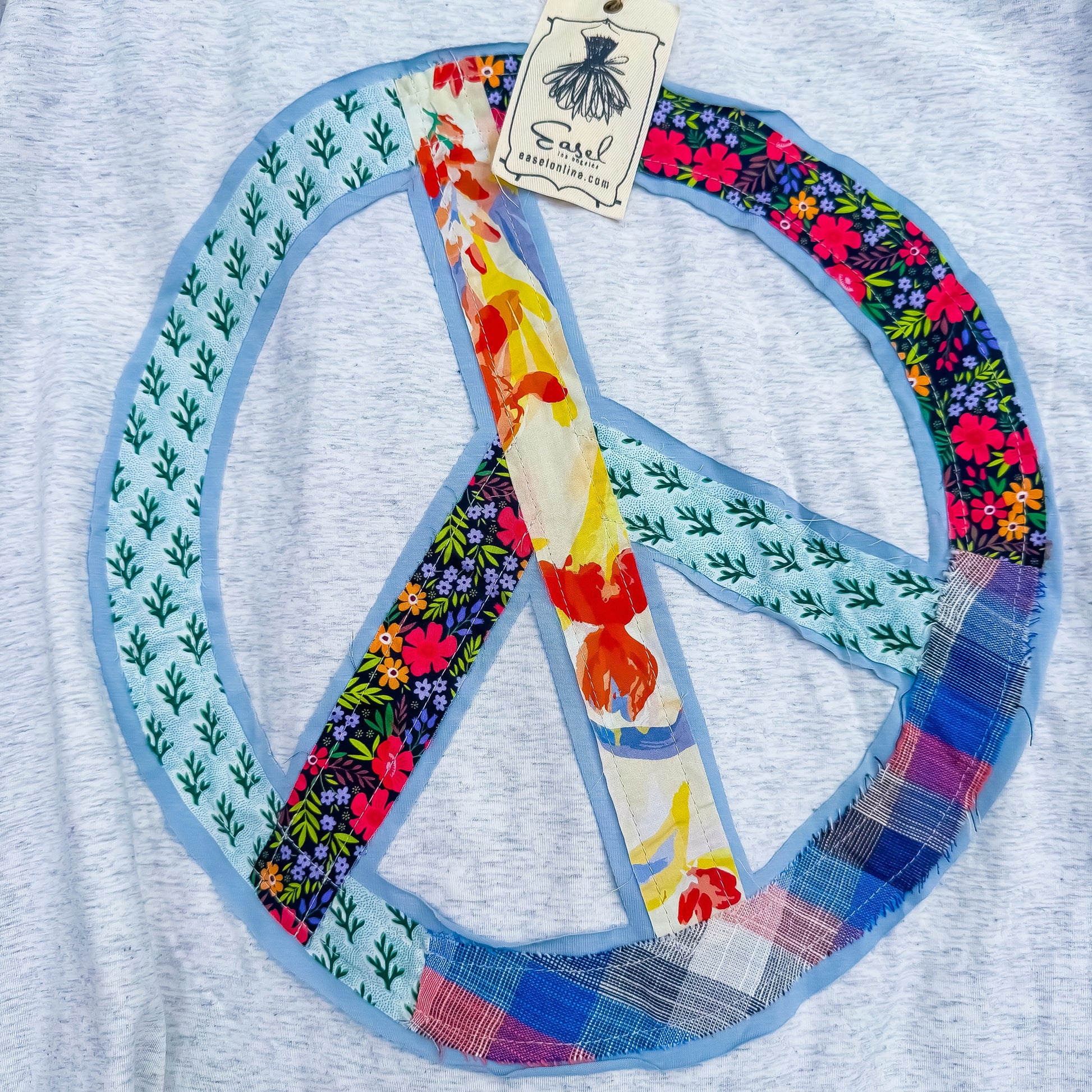 Patchwork peace sign detail on Heather Gray tee