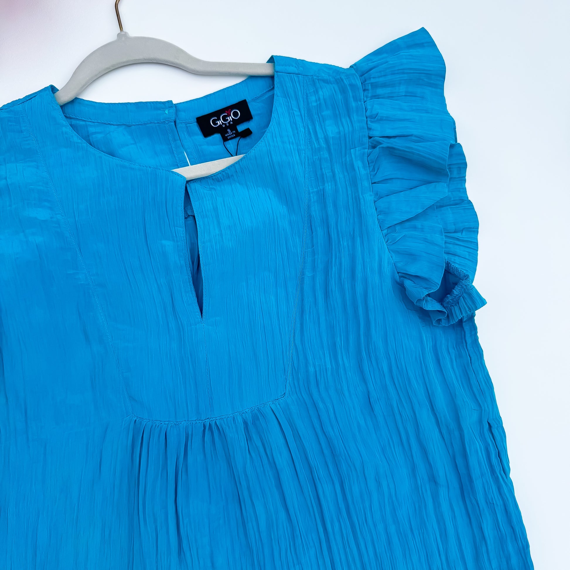Turquoise ruffle sleeve keyhole top detail