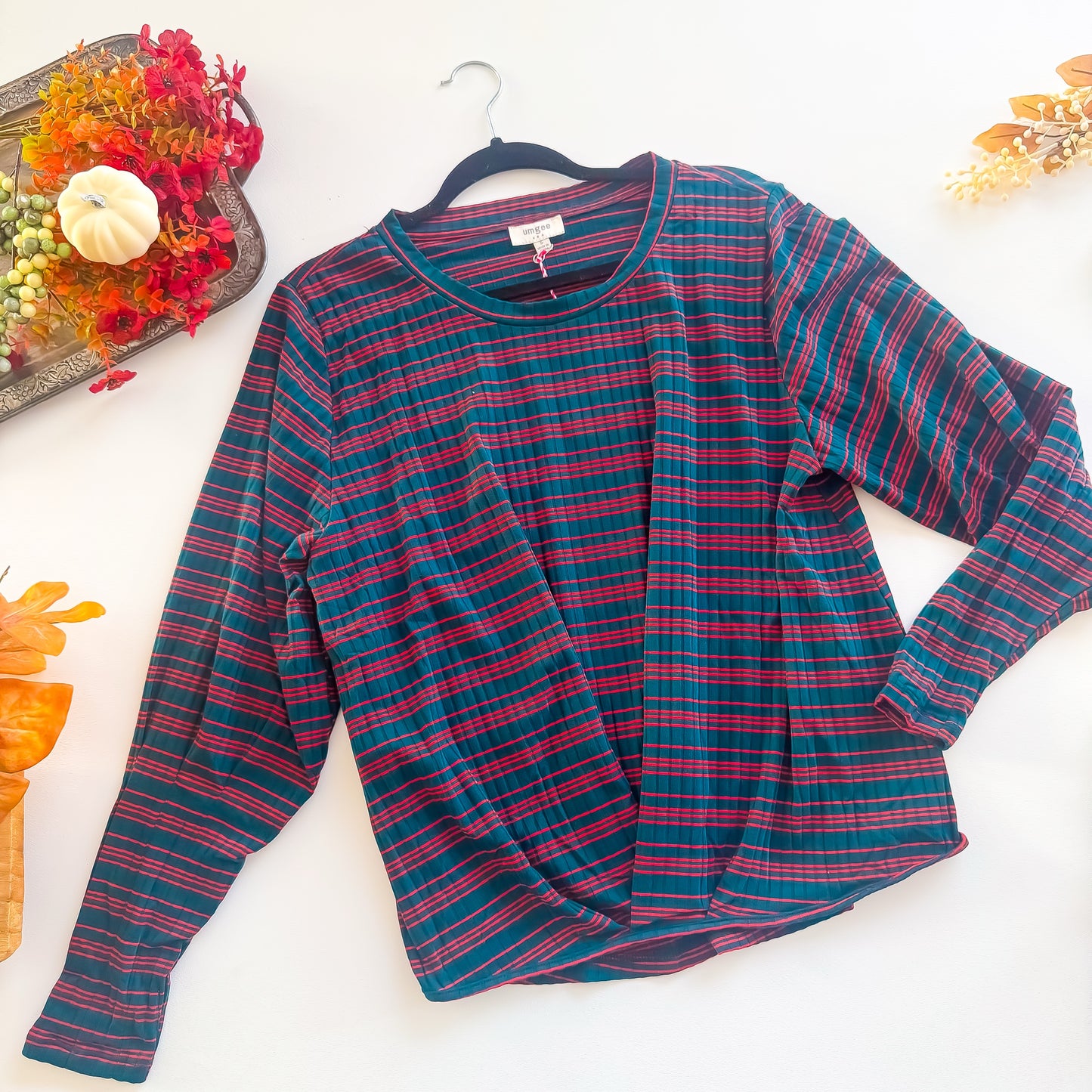 Teal and red striped ribbed twist hem long sleeve top