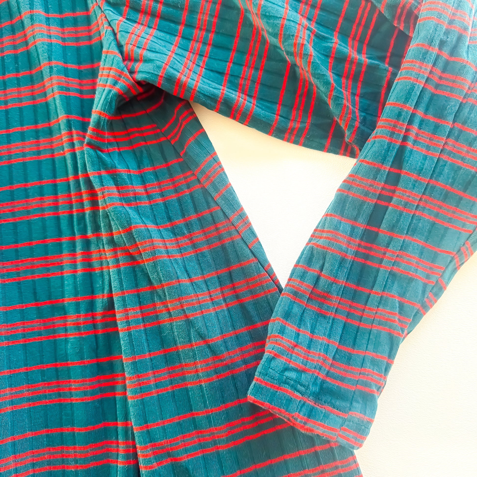 Teal and red striped ribbed top close up