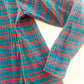 Teal and red striped ribbed top close up