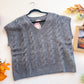 Charcoal cable knit fuzzy V-neck sweater vest close up